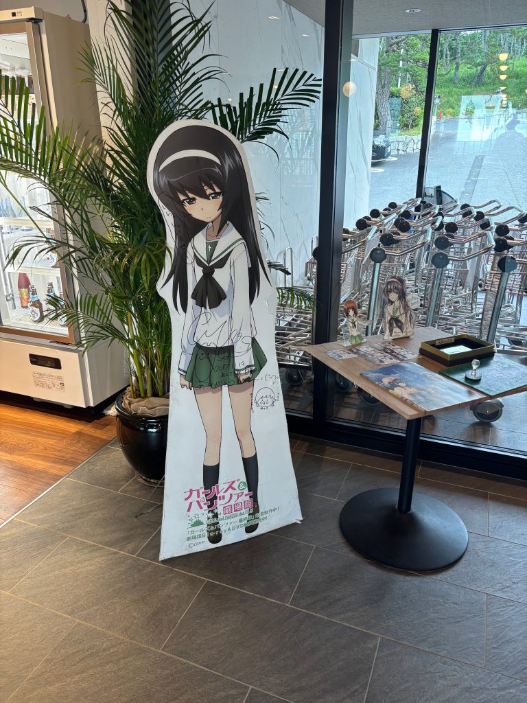 A "Girls Und Panzer" character in a hotel lobby in Oarai, Japan