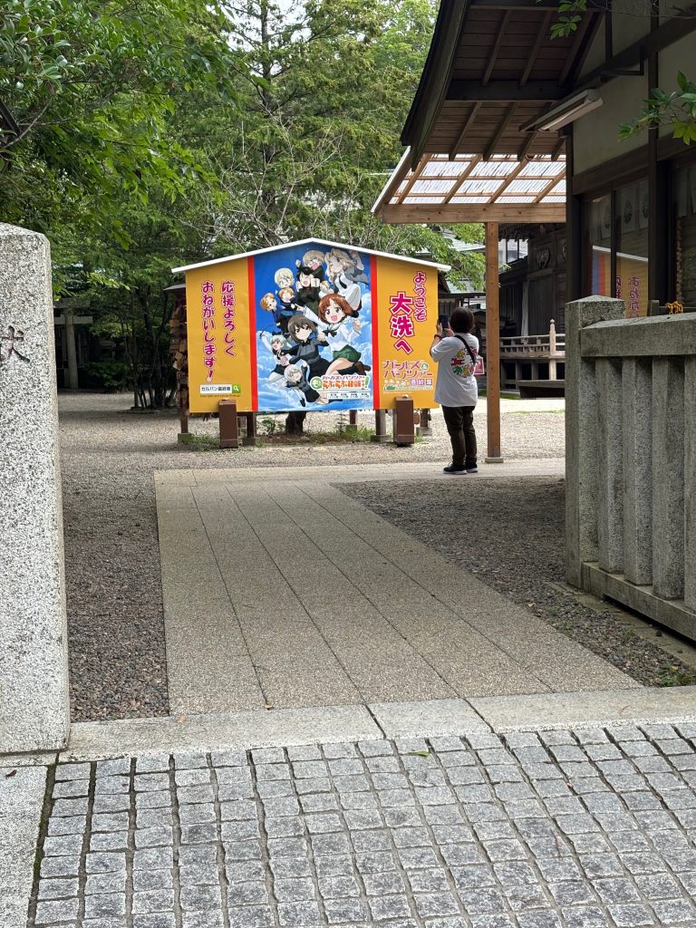 "Girls Und Panzer" sign near a shrine in Oarai, Japan