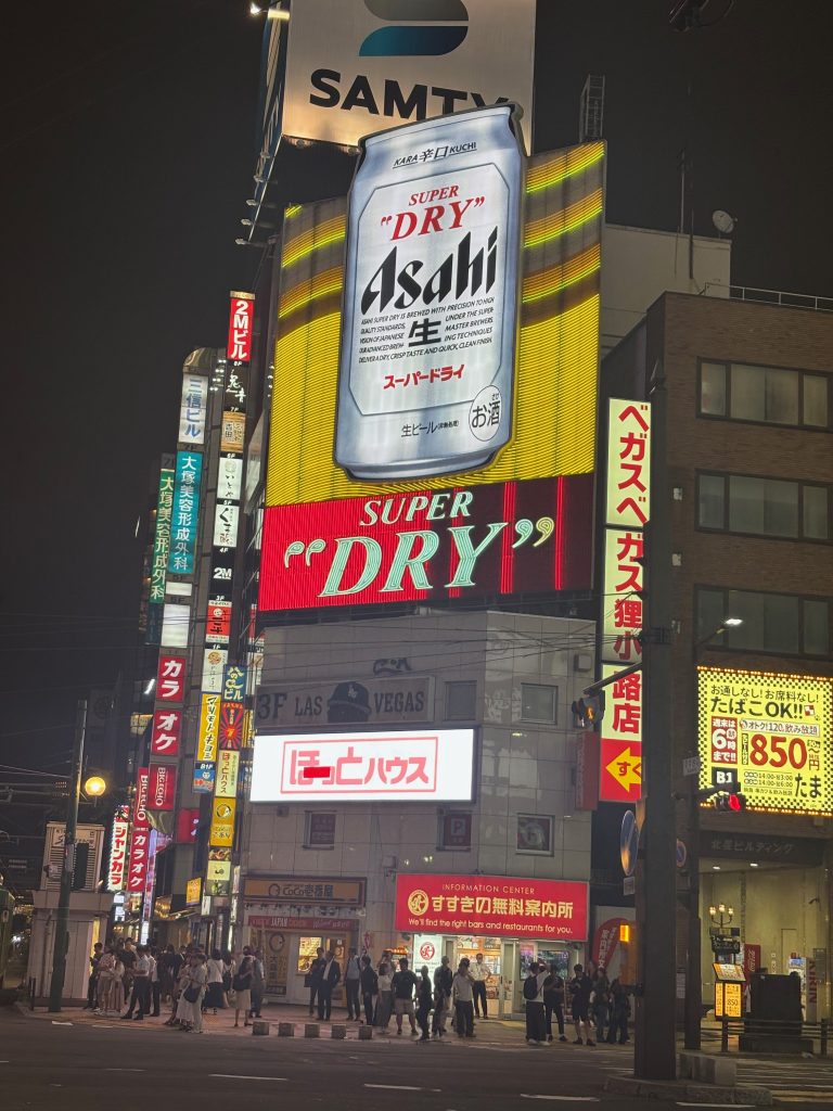 Asahi Dry beer sign lighted up at night in Sapporo